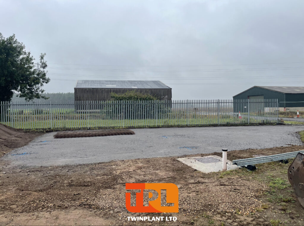 Ground levelling and site preparation in progress on an industrial plot.